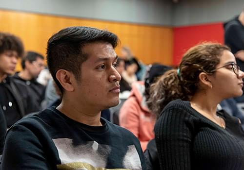 Students listening to a speech