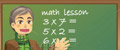 professor writing on blackboard