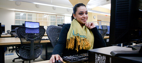 Student using a computer for the Digital Media track