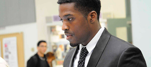 Student in a suit preparing for an interview