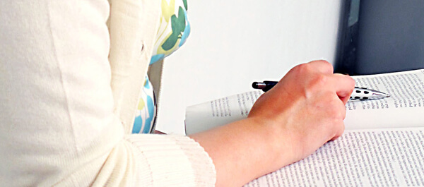 Human Services student studying with an open book