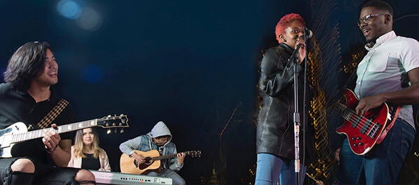 Music Option: Image of students performing a show for an audience