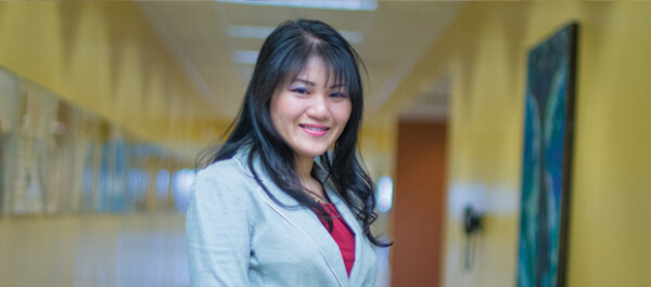 Paralegal Studies: Image of student in a suit posing