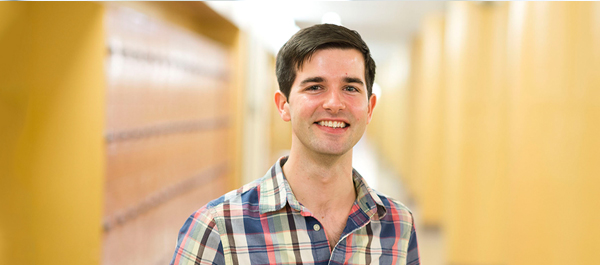  Image of male student by the lockers in the 2nd floor of the E-Building 