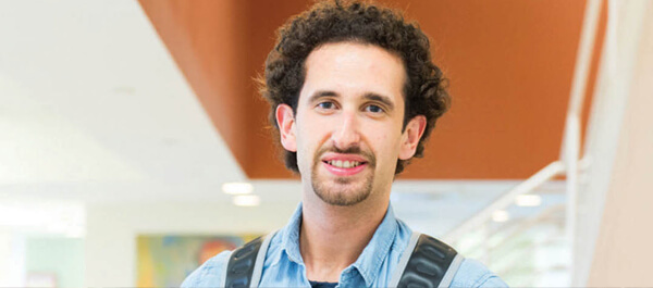 Travel, Tourism, and Hospitality Management: Image of a student with a backpack