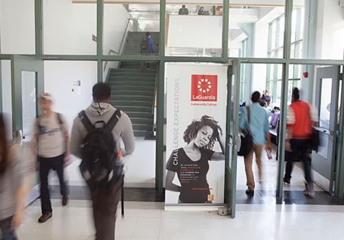 Students walking through a door