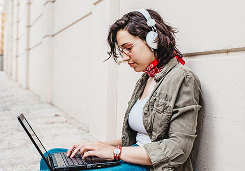 Student studying on a laptop