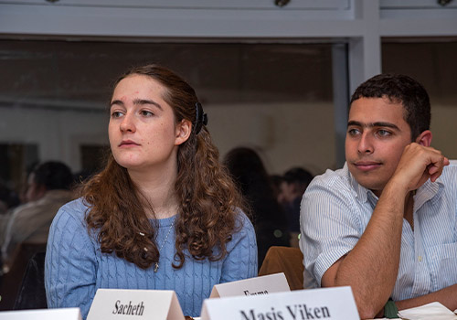 Two students sitting