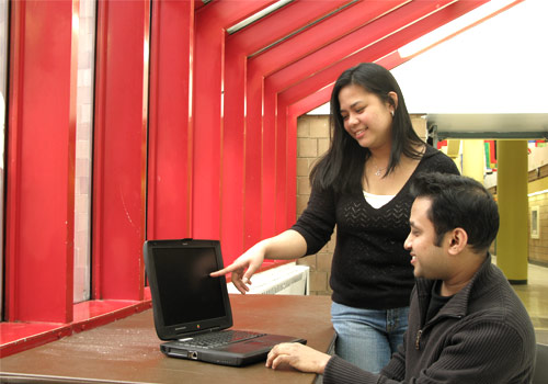 Students using a laptop computer