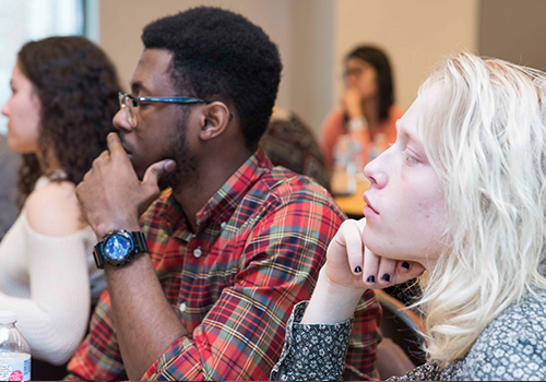 Students paying attention in a conference