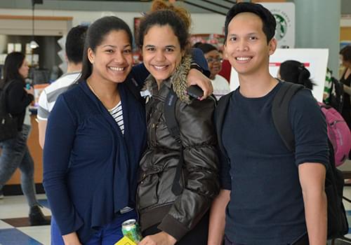 Students posing in the Atrium located in the E-Building