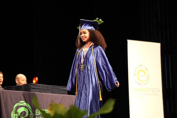 Moza Maryam walks across the stage as her name is being called.