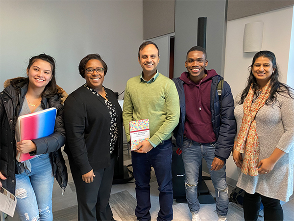 Dr. Inukonda, in middle (wearing green), with Interim Provost and Senior Vice President Nireata Seals at his left, and Humanities Department Chair Payal Doctor on the very right.