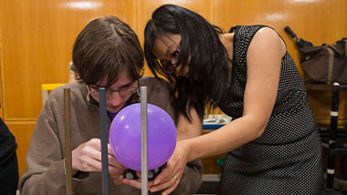 Two students doing an experiment