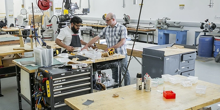 Two guys working in a workshop