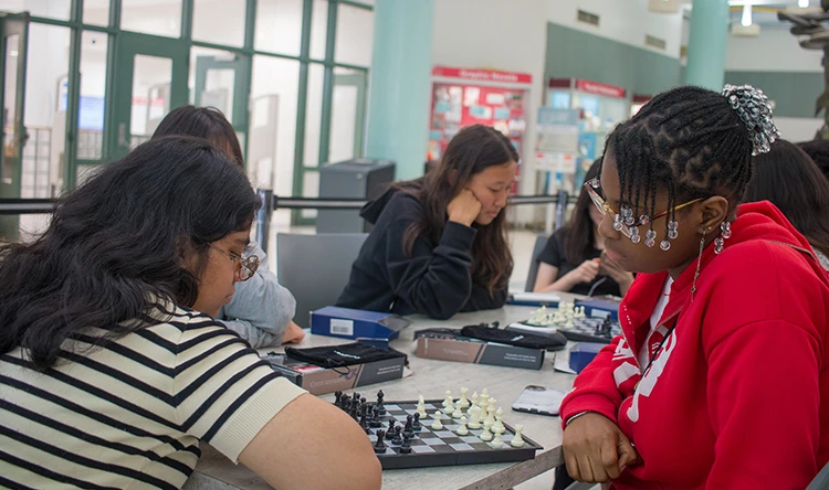 Students in the Atrium playing Chess