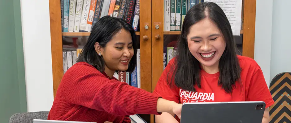 Students using a computer to look up information