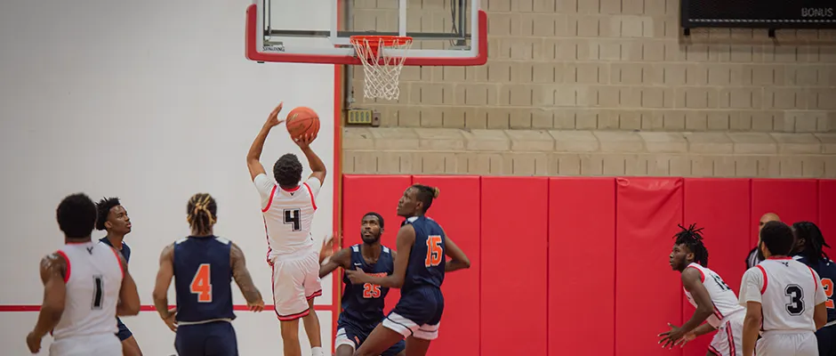 Image of the Men's Basketball Team playing a game