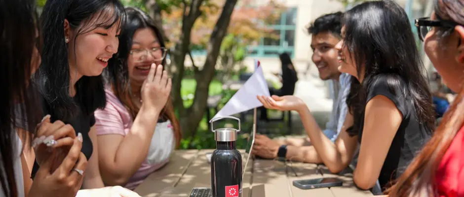 A Group of Students Talking Outside