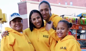 Photo shows Madeline, second from left, with a volunteer and her daughters, Angel and Gabriella